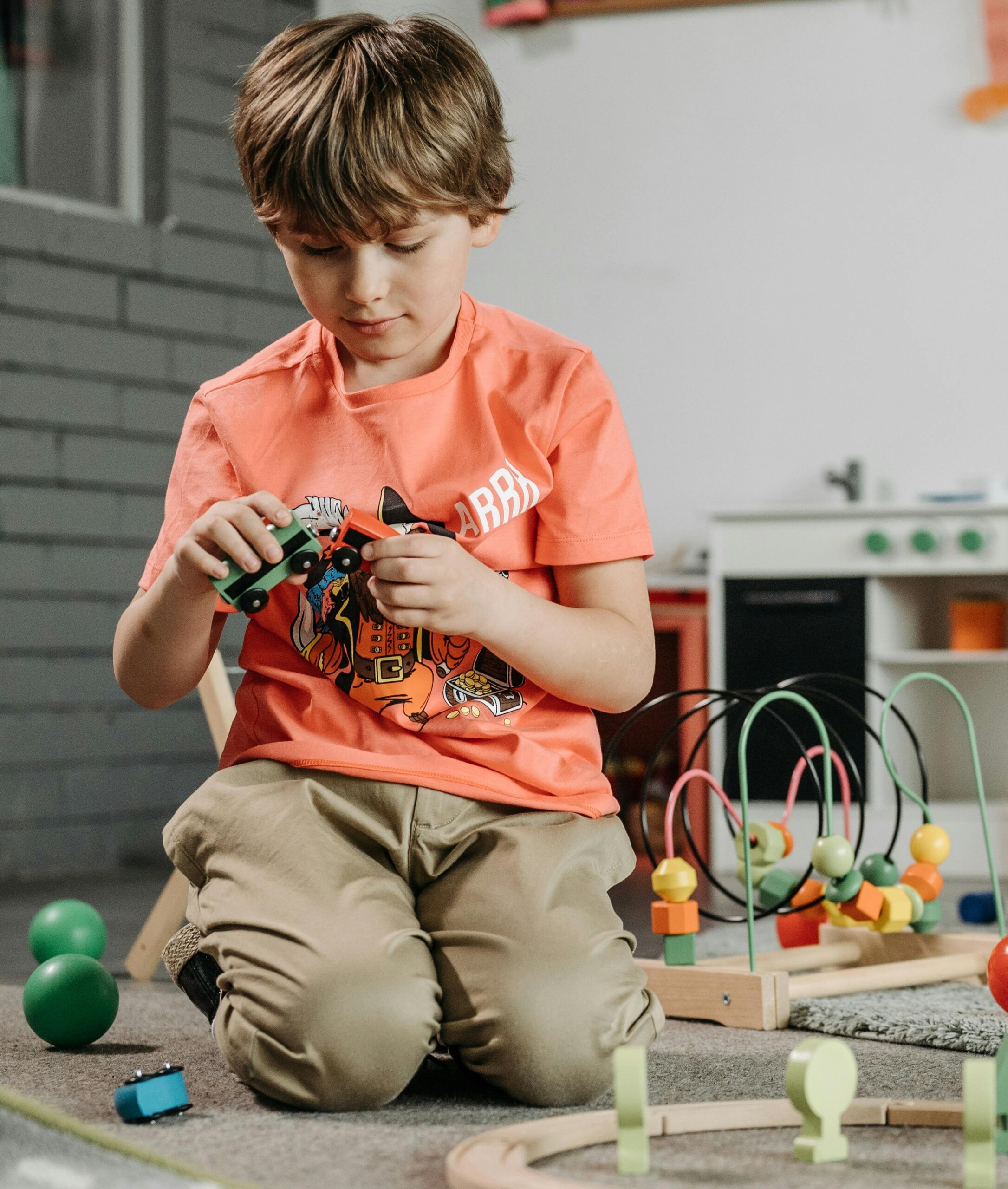 boy playing with toys in therapy boy playing with toys in therapy